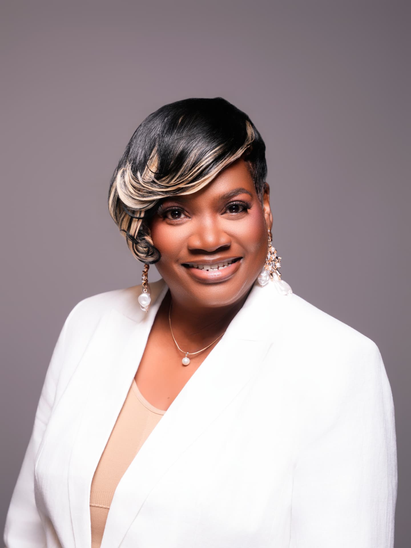 Dr. Alicia Collins, Treasurer of All Under One Roof